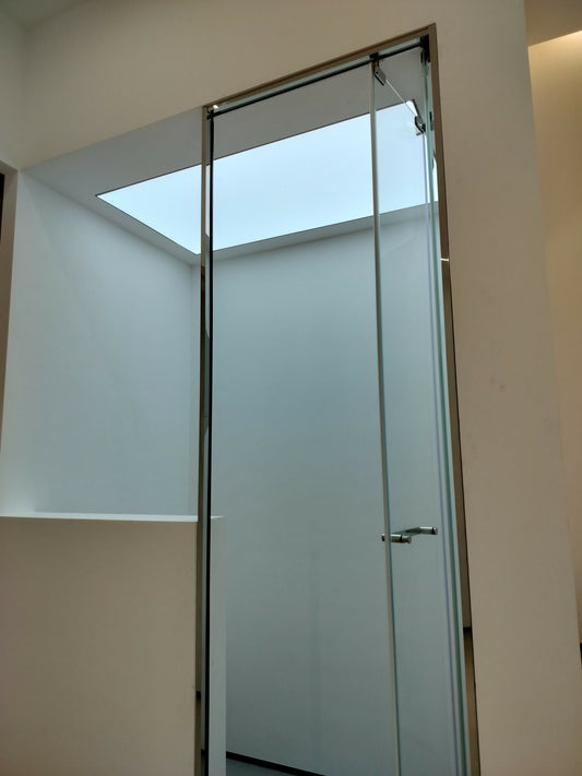 Folding glass shower door